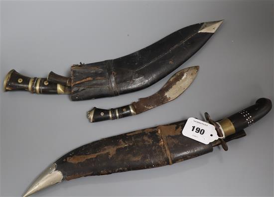 A Kukri knife, another and an Indian knife
